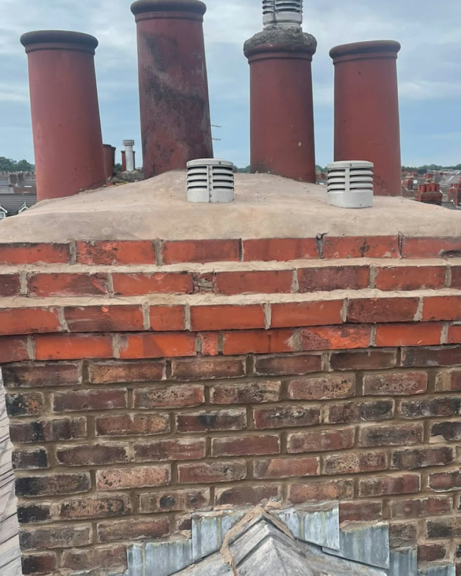 The same chimney with a new, smooth flaunching around the pots