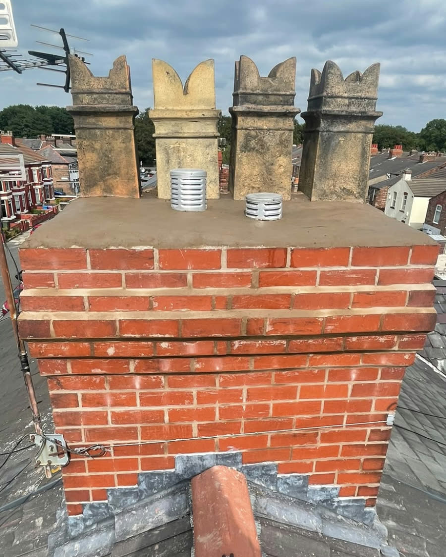 The same stack cleaned up, the joints made good and a fresh top around the pots