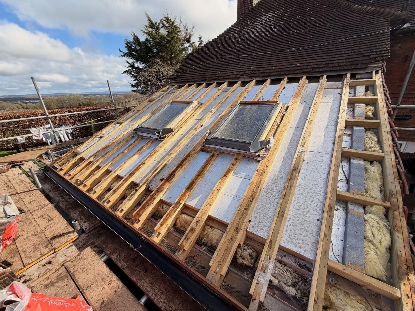 Roof stripped to new battens and membrane, ready for tiles