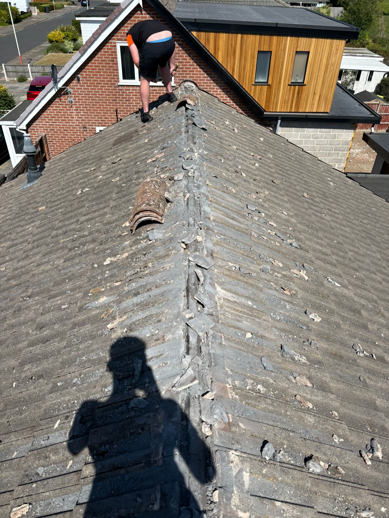 Checking the ridge line of a tiled roof